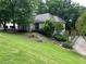 Landscaped front yard with lush green grass leading up to the front of the two-story home at 3897 Beacon St, Marietta, GA 30062