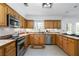 Spacious eat-in kitchen with stainless steel appliances, oak cabinets, and lots of natural light at 3897 Beacon St, Marietta, GA 30062