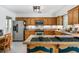 Bright eat-in kitchen featuring oak cabinets, a tiled backsplash, and stainless steel appliances at 3897 Beacon St, Marietta, GA 30062