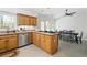 Bright eat-in kitchen with oak cabinets, granite counters and modern stainless steel appliances at 3897 Beacon St, Marietta, GA 30062