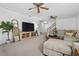 A bright living room features plush seating, a ceiling fan, and offers plenty of space for entertaining or relaxing at 3897 Beacon St, Marietta, GA 30062