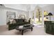 Comfortable living room features large windows, and a stylish seating arrangement with a view into another room at 3897 Beacon St, Marietta, GA 30062