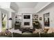 Bright living room boasts a fireplace, built-in shelving, and an open floor plan to the dining room at 3897 Beacon St, Marietta, GA 30062