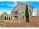 View of the backyard featuring a covered patio and level lot at 359 Woodridge Pass, Canton, GA 30114