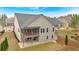 Aerial view of backyard including covered patio, lawn and landscaping at 359 Woodridge Pass, Canton, GA 30114