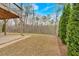 Backyard area with a view of the surrounding woods and a concrete patio at 359 Woodridge Pass, Canton, GA 30114
