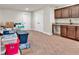 Spacious unfinished basement featuring carpet floors, white walls, and a convenient wet bar area at 359 Woodridge Pass, Canton, GA 30114