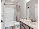 Well-lit bathroom featuring a bathtub with shower, toilet, and vanity with granite countertop at 359 Woodridge Pass, Canton, GA 30114