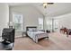 Large bedroom with natural light, vaulted ceilings, and a small balcony off the side at 359 Woodridge Pass, Canton, GA 30114
