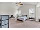 Spacious bedroom with vaulted ceilings, a ceiling fan, and two windows with natural light at 359 Woodridge Pass, Canton, GA 30114
