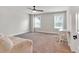 Bright bedroom featuring carpeted floors, dual windows, and neutral paint, creating a serene atmosphere at 359 Woodridge Pass, Canton, GA 30114