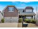 Charming two-story home with a well-manicured lawn and two-car garage at 359 Woodridge Pass, Canton, GA 30114