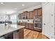 Modern kitchen with stainless appliances, double ovens, and dark wood cabinets at 359 Woodridge Pass, Canton, GA 30114