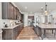 Spacious kitchen with stainless appliances, ample counter space, and wood flooring at 359 Woodridge Pass, Canton, GA 30114
