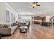 Open concept living room with lots of natural light and hardwood floors at 359 Woodridge Pass, Canton, GA 30114
