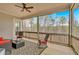 Inviting screened porch featuring comfortable seating and views of the surrounding nature at 359 Woodridge Pass, Canton, GA 30114