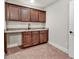 Wet bar featuring granite countertops, wooden cabinets, and a sink, perfect for entertaining guests at 359 Woodridge Pass, Canton, GA 30114