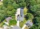 A private home is revealed in a leafy canopy with ample yard and driveway space at 3965 Hamilton View Way, Dacula, GA 30019