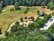 Overhead shot of a park featuring a playground, picnic area, and surrounded by lush trees at 3965 Hamilton View Way, Dacula, GA 30019