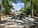 An inviting outdoor seating area with a fire pit nestled among trees in a backyard at 3965 Hamilton View Way, Dacula, GA 30019