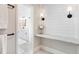 Bathroom area with a white marble vanity and a view into the main bathroom space at 3965 Hamilton View Way, Dacula, GA 30019