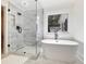 Bathroom featuring a freestanding tub, walk-in shower with white marble and modern fixtures at 3965 Hamilton View Way, Dacula, GA 30019