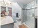 Bathroom features a glass-enclosed shower, updated fixtures, and a marble countertop at 3965 Hamilton View Way, Dacula, GA 30019