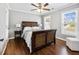 Bedroom featuring wood floors, natural light, a ceiling fan, and a woven headboard bed at 3965 Hamilton View Way, Dacula, GA 30019