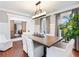 Elegant dining room featuring hardwood floors, modern lighting, and stylish barn doors at 3965 Hamilton View Way, Dacula, GA 30019