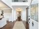 Bright foyer with dark wood floors, shiplap walls, and distinctive sliding barn door at 3965 Hamilton View Way, Dacula, GA 30019