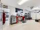 Custom garage with tool and work areas, epoxy floors, and lift at 3965 Hamilton View Way, Dacula, GA 30019