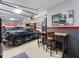 Custom garage featuring car lift, epoxy floors, and wall art at 3965 Hamilton View Way, Dacula, GA 30019