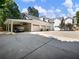 Attached three-car garage and covered parking with paved driveway at 3965 Hamilton View Way, Dacula, GA 30019