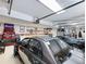 Custom garage with car lift, epoxy floors, and race car themed decor at 3965 Hamilton View Way, Dacula, GA 30019