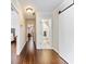 Hallway with dark wood floors and access to several rooms, including a bathroom and bedroom at 3965 Hamilton View Way, Dacula, GA 30019