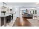 Open concept kitchen flowing into the living room for seamless entertaining at 3965 Hamilton View Way, Dacula, GA 30019