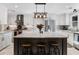 Bright, open kitchen with white cabinets and stainless steel appliances at 3965 Hamilton View Way, Dacula, GA 30019