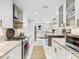 Spacious kitchen with white cabinets, stainless appliances, and marble countertops at 3965 Hamilton View Way, Dacula, GA 30019
