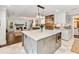 Open kitchen featuring a large island with bar stool seating and stainless steel appliances at 3965 Hamilton View Way, Dacula, GA 30019