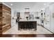 Spacious kitchen with white cabinets, stainless steel appliances, and a dark gray island at 3965 Hamilton View Way, Dacula, GA 30019
