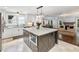 Open concept kitchen features an island, modern appliances, and natural light at 3965 Hamilton View Way, Dacula, GA 30019