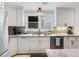 Kitchen with stainless steel appliances, stone countertops, and custom cabinetry at 3965 Hamilton View Way, Dacula, GA 30019