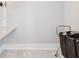 Laundry room showing a white quartz countertop with a rolling laundry basket at 3965 Hamilton View Way, Dacula, GA 30019