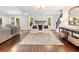 Spacious living room with hardwood floors, fireplace, and plenty of natural light at 3965 Hamilton View Way, Dacula, GA 30019