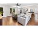 Inviting living room with hardwood floors, fireplace, and comfortable seating at 3965 Hamilton View Way, Dacula, GA 30019