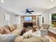 Cozy living room with a TV, wood accent wall, and neutral furniture at 3965 Hamilton View Way, Dacula, GA 30019
