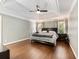 Spacious main bedroom with a tray ceiling, hardwood floors and neutral paint colors at 3965 Hamilton View Way, Dacula, GA 30019