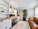 Comfortable home office featuring built-in bookshelves and a leather sofa at 3965 Hamilton View Way, Dacula, GA 30019