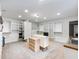 Large walk-in closet featuring carpeted floors, custom shelving, and vanity with a sink at 3965 Hamilton View Way, Dacula, GA 30019