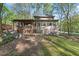 Rear view of the house highlighting the deck and screened in porch at 5269 Blue Grass Ln, Sugar Hill, GA 30518